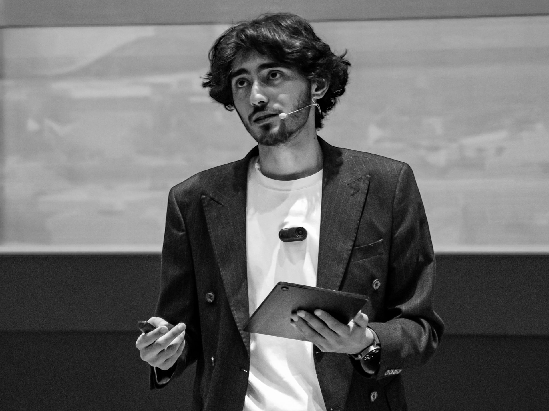 Huseyn Abizadeh speaking on stage